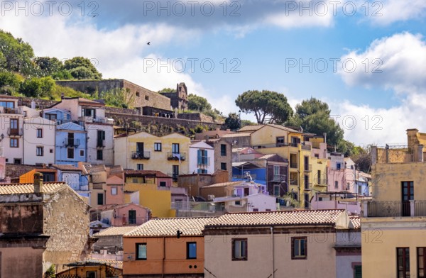 Sardinia, picturesque view of Bosa with pavilions on the promenade, residential buildings and castle Castello di Serravalle, Bosa, Europe, Province of Oristano, Italy, old building, old town, architecture, view, Castello di Serravalle, recreation, flair, river, photography, building, history, sky, hill, culture, landscape, Mediterranean, nature, local view, panorama, pavilions, promenade, travel, castle, sight, sightseeing, summer, town, cityscape, tourism, tourist attraction, holiday, residential buildings, charming, historic, Italian, picturesque, Mediterranean, romantic, touristy, traditional