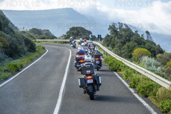Sardinia, biker motorcyclist on the mountainous coastal road, Villanova Monteleone, Europe, Province of Sassari, Italy, adventure, asphalt, view, mountains, movement, biker, discovery, driving fun, ride, vehicle, freedom, speed, helmet, sky, curves, coast, landscape, sea view, Mediterranean, motorcyclist, male, nature, outdoor, travel, protective clothing, sightseeing, sport, road, daylight, tourism, environment, mountainous coastal road, adult, rural