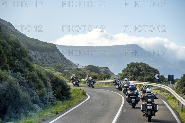 Sardinia, biker motorcyclist on the mountainous coastal road, Villanova Monteleone, Europe, province of Sassari, Italy, adventure, asphalt, view, biker, recreation, exploration, driver, ride, freedom, leisure, mountains, railing, speed, helmet, curves, coast, landscape, motorbike, motorcyclist, nature, panoramic view, travel, signs, protective clothing, sightseeing, road, daytime, tourism, transport, environment, mountainous coastal road, Italian, Mediterranean, sporty