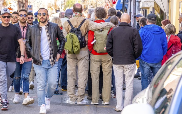 Sardinia, tourists in a pedestrian zone, stroll of tourists on a shopping alleyway, Bosa, Europe, Province of Oristano, Italy, old town, architecture, atmosphere, visitor, stroll, shopping alleyway, shopping bags, discover, exploration, flair, photographing, leisure, pedestrian zone, alleyways, buildings, shops, cobblestones, culture, people, travel, shopping, sightseeing, summer, souvenirs, walking, city, alleyway life, tourism, tourists, tradition, holiday, relax, historic, Italian, lively, Mediterranean, urban environment
