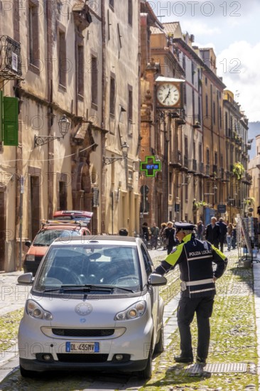 Sardinia, police control in a pedestrian zone, Bosa, Europe, Oristano province, Italy, everyday life, architecture, outdoor, officials, pedestrian, pedestrian zone, building, control, location, people, order, passers-by, police, police control, protection, security, sightseeing, city, pavement, scenario, day, tourism, uniforms, urban, traffic, traffic safety, administration, landmark, cooperation, peaceful, Mediterranean, review, surveillance, public space