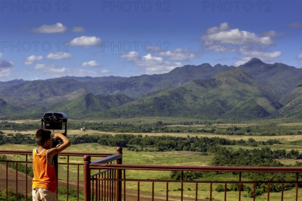 Mirador, Viewpoint over the valley of Ingenios, Valle de los Ingenios with little boy and binoculars, Cuba, Sancti Spíritus, Sancti Spíritus