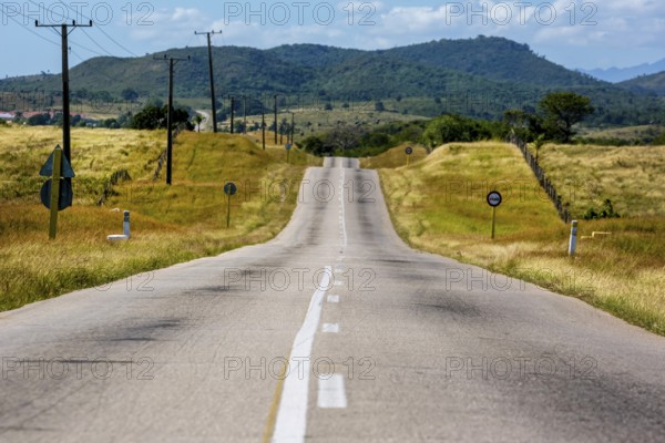 Country road between Santa Clara and Trinidad Valley of Ingenios, Valle de los Ingenios, country road with central reservation, Valle Ingenios, Cuba, Central America