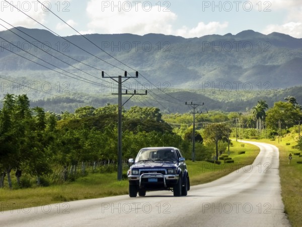 Country road between Santa Clara and Trinidad Valley of Ingenios, Valle de los Ingenios, country road with central reservation, Valle Ingenios, Cuba, Central America