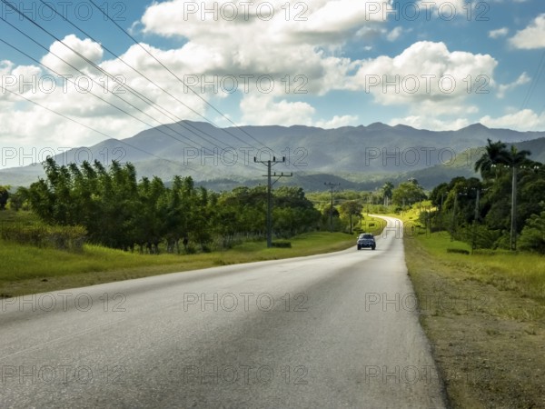 Country road between Santa Clara and Trinidad Valley of Ingenios, Valle de los Ingenios, country road with central reservation, Valle Ingenios, Cuba, Central America