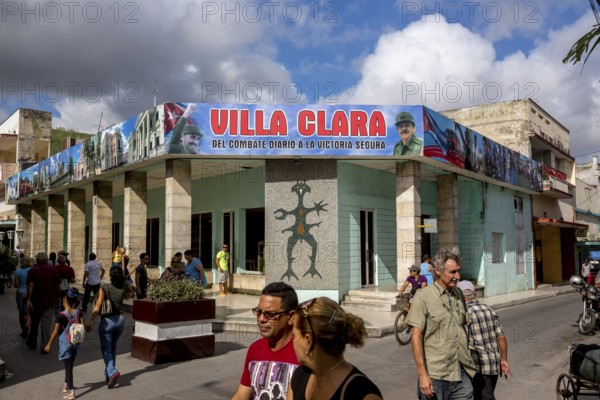 Comandante Fidel Castro on a poster in the city centre, Streetlife in the city centre of Santa Clara at the Parque de Santa Clara, Santa Clara, Cuba, Villa Clara