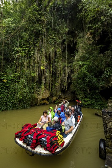 Exit of the cave system, tourists in an electric boat with life jackets, caves of the Indios, Cueva del Indio, underground caves with a watercourse river accessible to tourists, Viñales, Cuba, Central America, Cuba, Caribbean