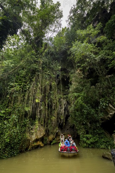 Exit of the cave system, tourists in an electric boat with life jackets, caves of the Indios, Cueva del Indio, underground caves with a watercourse river accessible to tourists, Viñales, Cuba, Central America, Cuba, Caribbean