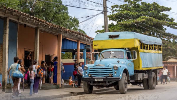 Bus stop and lorry for passenger transport, bus, public transport, local public transport, lorry in yellow and turquoise, Viñales, Cuba, Pinar del RÃo