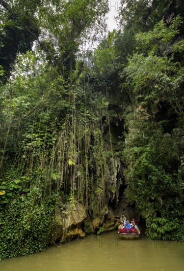 Exit of the cave system, tourists in an electric boat with life jackets, caves of the Indios, Cueva del Indio, underground caves with a watercourse river accessible to tourists, Viñales, Cuba, Central America, Cuba, Caribbean