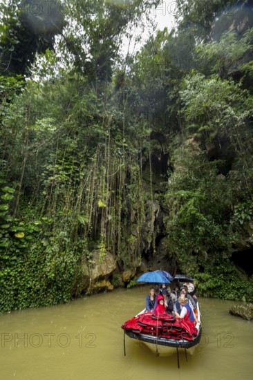 Exit of the cave system, tourists in an electric boat with life jackets, caves of the Indios, Cueva del Indio, underground caves with a watercourse river accessible to tourists, Viñales, Cuba, Central America, Cuba, Caribbean