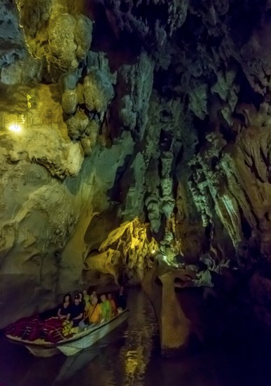 Tourists in a boat on the underground rivers in the caves of the Indios, Cueva del Indio, underground caves with a watercourse river accessible to tourists, Viñales, Cuba, Central America, Cuba, Caribbean