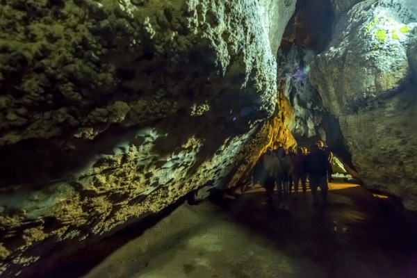 Tourists roam the caves, Caves of the Indians, Cueva del Indio, underground caves with a watercourse river open to tourists, Viñales, Cuba, Central America, Cuba, Caribbean
