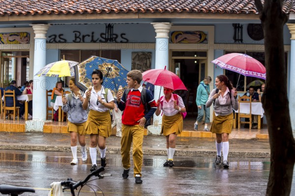 School children, pupils crossing a street in Vinales, Viñales, Cuba, Pinar del Río, Viñales, Pinar del Río