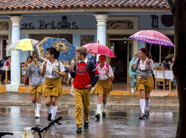 School children, pupils crossing a street in Vinales, Viñales, Cuba, Pinar del Río, Viñales, Pinar del Río