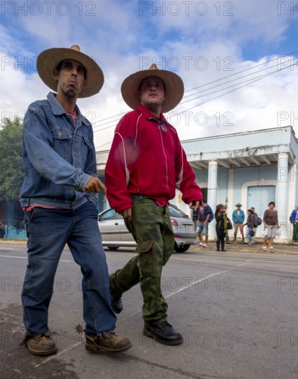 Two cowboys with riding boots and spurs on the street in Vinales, Viñales, Cuba, Pinar del Río, Cuba, Viñales, Pinar del Río