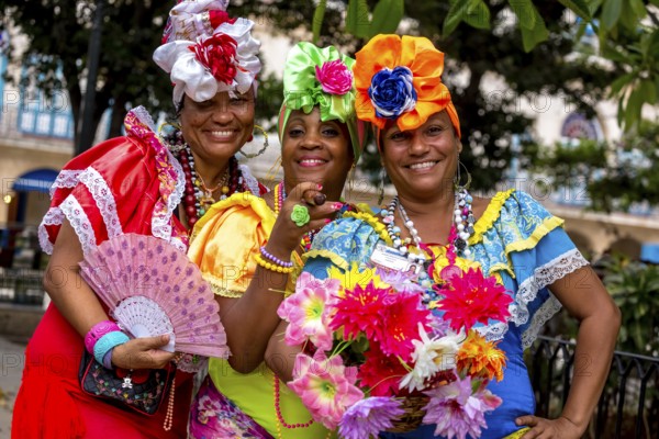 Three Cuban beauties on the streets of Old Havana in their colourful Spanish-inspired costumes, La Habana, Cuba, Caribbean, Central America, Cuba, Europe, aerial photo, birds-eyes view, aerial photography, aerial photography, overview, bird's eye view
