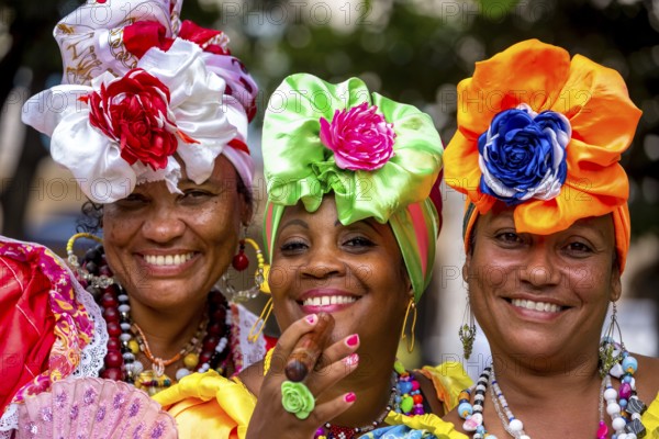 Three Cuban beauties on the streets of Old Havana in their colourful Spanish-inspired costumes, La Habana, Cuba, Caribbean, Central America, Cuba, Europe, aerial photo, birds-eyes view, aerial photography, aerial photography, overview, bird's eye view