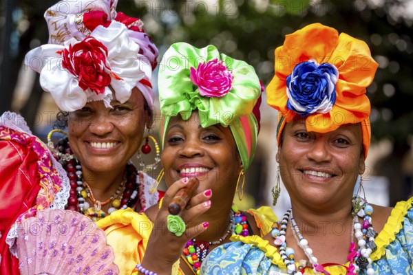 Three Cuban beauties on the streets of Old Havana in their colourful Spanish-inspired costumes, La Habana, Cuba, Caribbean, Central America, Cuba, Europe, aerial photo, birds-eyes view, aerial photography, aerial photography, overview, bird's eye view