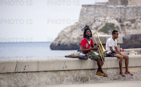 Young Cubans on the walls of the Malecon trombonist, musicians outdoors with dreadlocks, La Habana, Havana, Cuba, Cuba, Europe, aerial view, birds-eyes view, aerial photography, aerial photography, overview, bird's eye view