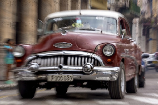 Red vintage car in street scene, Old American road cruiser on the streets of Havana, taxi, La Habana, Havana, Cuba, Cuba, Europe, aerial view, birds-eyes view, aerial photography, aerial photography, overview, bird's eye view