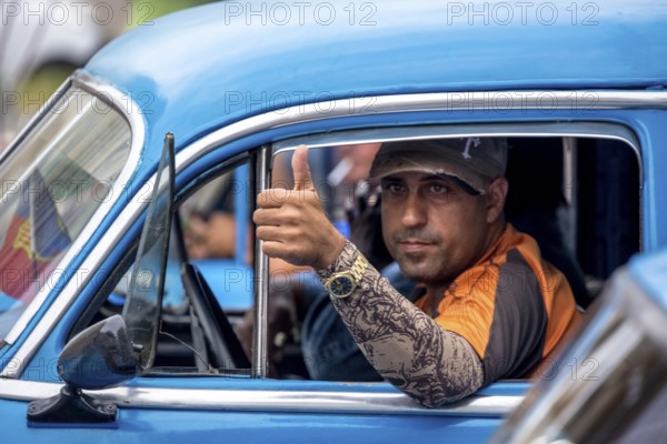 Taxi driver, blue vintage car in street scene, old American street cruiser on the streets of Havana, taxi, La Habana, Havana, Cuba, Cuba, Europe, aerial photo, birds-eyes view, aerial photography, aerial photography, overview, bird's eye view