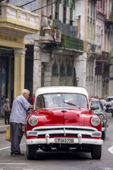 Red and white vintage car in street scene, Old American street cruiser on the streets of Havana, Taxi, La Habana, Havana, Cuba, Cuba, Europe, aerial view, birds-eyes view, aerial photography, aerial photography, aerial photography, overview, bird's eye view