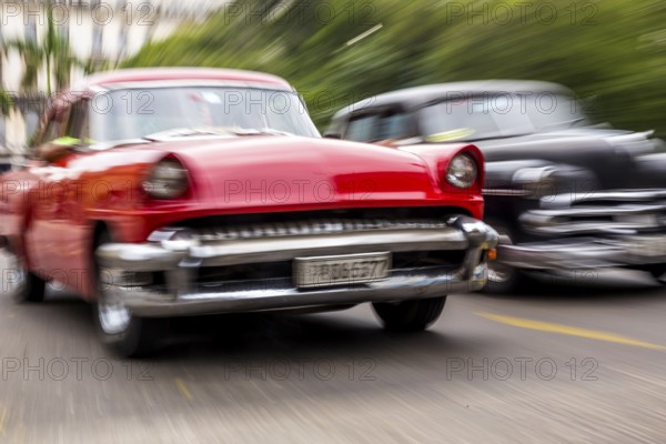 Speed, blurred, moving old car, red oldtimer in street scene, old american street cruiser on the streets of Havana, taxi, La Habana, Havana, Cuba, Cuba, Europe, aerial view, birds-eyes view, aerial photography, aerial photography, overview, bird's eye view