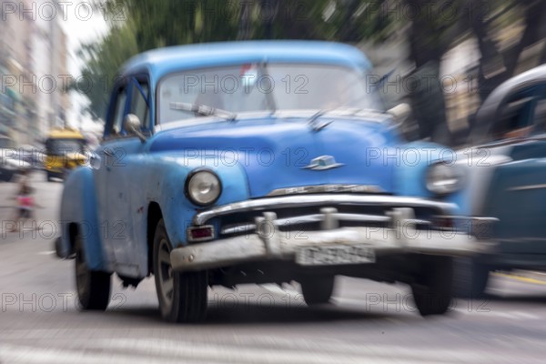 Blue vintage car in street scene, Old American street cruiser on the streets of Havana, Taxi, La Habana, Havana, Cuba, Cuba, Europe, aerial view, birds-eyes view, aerial photography, aerial photography, aerial photography, overview, bird's eye view