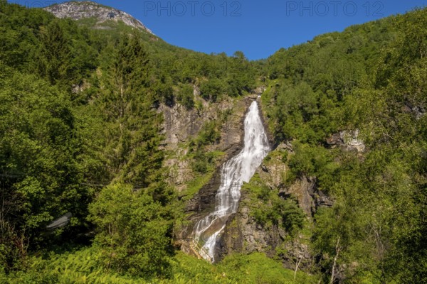 Waterfall near Stahlheim, mountains, baür sky, Skulestadmo, Hordaland, Norway, Scandinavia, Europe, Stalheim, NOR, travel, tourism, destination, sightseeing, sea voyage, Hurtigruten, Hurtigruten trip, tourism, Norwegian, Scandinavian, tourist, cruise, adventure trip, landscape, trees, forest, forestry, agriculture, water, valley, meadows, houses