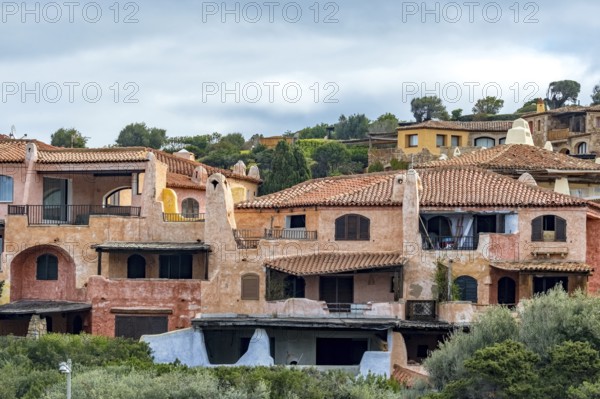 Sardinia, residential complex, worth seeing harbour town Porto Cervo, Arzachena, Europe, province Sassari, Italy, architecture, exterior view, inhabitants, relaxation, recreation, exclusivity, holiday resort, leisure, building, harbour town, coast, coastal town, luxurious, sea view, Porto Cervo, travel, sightseeing, summer, daylight, tourism, holiday, holiday destination, residential building, marina, blue sea, European, upscale, Italian, picturesque, Mediterranean, sunny