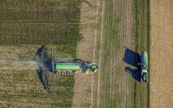 Aerial view, Tractor and agricultural spraying machine on a field, Paradiese, Soest, Soester Börde, North Rhine-Westphalia, Germany, DE, Europe, agriculture, aerial view, aerial photography, aerial photography, sprayer, tractor, overview, bird's-eye view, meadows and fields, birds-eyes view, overview