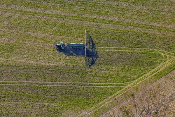 Aerial view, Tractor and agricultural spraying machine on a field, Paradiese, Soest, Soester Börde, North Rhine-Westphalia, Germany, DE, Europe, agriculture, aerial view, aerial photography, aerial photography, sprayer, tractor, overview, bird's-eye view, meadows and fields, birds-eyes view, overview