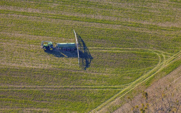 Aerial view, Tractor and agricultural spraying machine on a field, Paradiese, Soest, Soester Börde, North Rhine-Westphalia, Germany, DE, Europe, agriculture, aerial view, aerial photography, aerial photography, sprayer, tractor, overview, bird's-eye view, meadows and fields, birds-eyes view, overview
