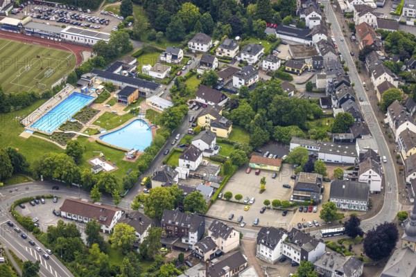 Aerial view, outdoor swimming pool Sprockhövel at Baumhof stadium, on the right Volksbank headquarters Mühlenstraße and half-timbered house Schultenhof Leveringhaus, Niedersprockhövel, Sprockhövel, Ruhr area, North Rhine-Westphalia, Germany, bathing establishment, bathing resort, DE, Europe, outdoor swimming pool, leisure activities, aerial view, aerial photography, aerial photography, swimming pool, overview, bird's-eye view, overview