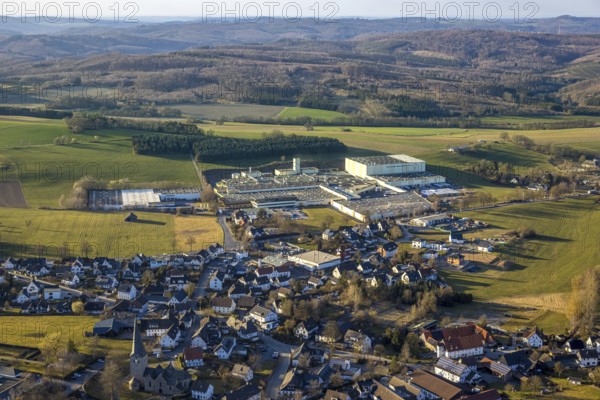 Aerial view, town centre Stockum (Sauerland) with catholic St. Pankratius church, heritage-protected church building, Tillmann Wellpappe-Verpackungen factory premises, commercial area, hilly landscape with forest and distant view, Stockum, Sundern, Sauerland, North Rhine-Westphalia, Germany, DE, Europe, commercial enterprises, commercial area, commercial property, commercial location, commercial use, industrial area, industrial location, aerial photograph, aerial photography, aerial photography, overview, bird's-eye view, overview