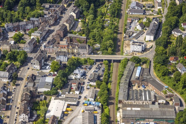 Aerial view, construction site with new building on Heeger Straße bridge, Heegerstraße residential area and historic heritage-protected houses and facades, railway tracks, Oberbonsfeld, Velbert, Ruhr area, North Rhine-Westphalia, Germany, architecture, construction work, construction workers, construction area, construction site, scaffolding, building plots, construction project, construction site, bridge, DE, monument protection, development, Europe, river, progress, building, house, Heegerstraße, industrial area, infrastructure, construction, Langenberg, aerial view, aerial photography, aerial photography, machines, planning, rails, city, urban development, roads, urban, overview, traffic network, bird's-eye view, residential area, birds-eyes view, overview