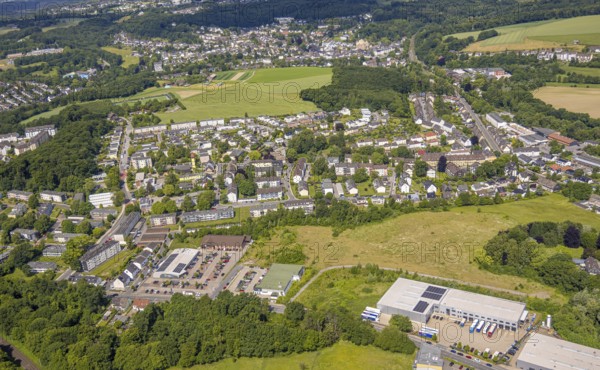 Aerial view, residential area Dichtersiedlung around Goethestraße and Schillerstraße, TransLog West transport company with solar roof, Aldi and Edeka supermarket with solar roof at Rosenhügel, Siebeneick, Wuppertal, Ruhr area, North Rhine-Westphalia, Germany, DE, Europe, property tax, real estate, aerial view, aerial photography, aerial photography, Neviges, overview, Velbert, bird's-eye view, housing estate, housing and living, residential area, quality of living, residential neighbourhood, housing estate, residential district, birds-eyes view, overview