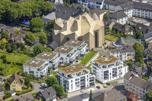 Aerial view, Mariendom and futuristic roof construction of the catholic church, Franciscan monastery Hardenberg with catholic parish church St. Mariä Empfängnis, Rundbau Pfarrzentrum Glocke, construction site with new construction of apartment buildings on the former hospital site, Neviges, Velbert, Ruhr area, North Rhine-Westphalia, Germany, construction work, construction area, building site, building plots, construction project, construction site, DE, Europe, aerial view, aerial photography, aerial photography, new construction, overview, bird's-eye view, birds-eyes view, overview
