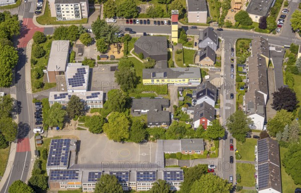 Aerial view, catholic Sonnenschule primary school and Städt. Community primary school Wielandstraße Regenbogenschule with roof with solar panels, church tower with community centre Siepen, Neviges, Velbert, Ruhr area, North Rhine-Westphalia, Germany, place of worship, education, DE, roof with solar panels, Europe, photovoltaic, place of worship, primary school, sanctuary, church, parish, educational institute, aerial view, aerial photography, aerial photography, photovoltaic system, religion, school, solar, solar system, solar roof, solar energy, solar panels, solar power system, overview, bird's eye view, birds-eyes view, overview