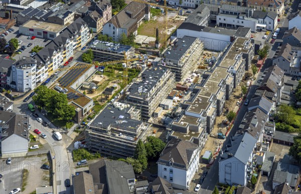 Aerial view, construction site with new residential building Sternbergstraße on the former company site Wittkopp and Berninghaus, day care centre Nordstraße, roof with solar panels, Velbert, Ruhr area, North Rhine-Westphalia, Germany, architecture, exterior view, construction work, construction area, construction site, building plots, construction cranes, construction measure, construction project, construction site, Berninghaus, education, DE, German, development, Europe, photovoltaic, building, site, large construction site, industrial area, infrastructure, childcare, kindergarten, day-care centre, day-care facility, day-care centre for children, climate day-care centre, aerial view, aerial photography, aerial photography, new building, Nordstraße, photovoltaic system, planning, solar, solar system, solar roof, solar energy, solar panels, solar power system, playground, urban development, Sternbergstraße, urban, overview, environment, bird's-eye view, Wittkopp, residential building, ...