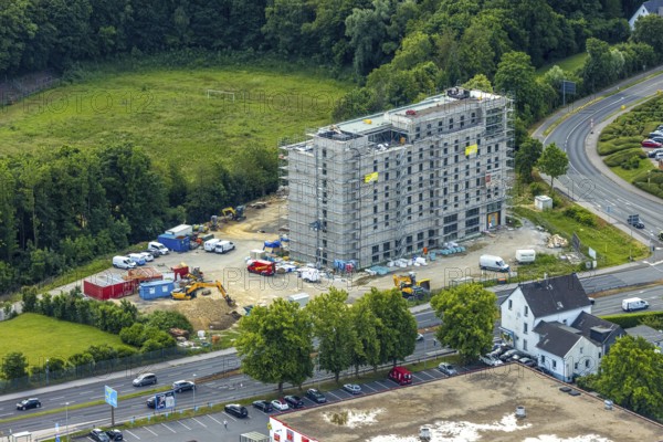 Aerial view, construction site with new hotel building on the corner of Flandersbacher Weg and Heiligenhauser Straße, Velbert, Ruhr area, North Rhine-Westphalia, Germany, architecture, construction work, construction workers, construction area, construction site, building plots, construction project, construction measure, construction phase, construction project, construction site, construction site vehicles, DE, corner plot, development, Europe, Flandersbacher Weg, progress, open space, catering, building, commercial enterprises, commercial area, commercial area, commercial property, commercial use, Heiligenhauser Straße, sky, hotel facilities, hotel industry, real estate, industrial location, infrastructure, construction, crane, aerial view, aerial photography, aerial photography, machines, modernisation, new construction, planning area, project, city, urban development, roads, overview, accommodation, urban, traffic, bird's-eye view, overview, VelbertMitte