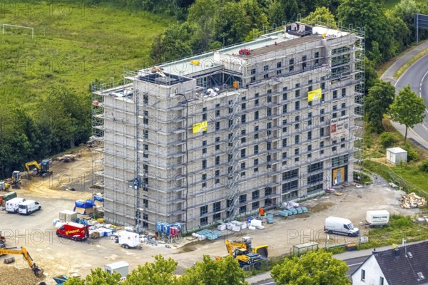 Aerial view, construction site with new hotel building on the corner of Flandersbacher Weg and Heiligenhauser Straße, Velbert, Ruhr area, North Rhine-Westphalia, Germany, architecture, construction work, construction workers, construction area, construction site, building plots, construction project, construction measure, construction phase, construction project, construction site, construction site vehicles, DE, corner plot, development, Europe, Flandersbacher Weg, progress, open space, catering, building, commercial enterprises, commercial area, commercial area, commercial property, commercial use, Heiligenhauser Straße, sky, hotel facilities, hotel industry, real estate, industrial location, infrastructure, construction, crane, aerial view, aerial photography, aerial photography, machines, modernisation, new construction, planning area, project, city, urban development, roads, overview, accommodation, urban, traffic, bird's-eye view, overview, VelbertMitte
