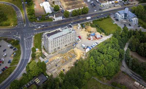 Aerial view, construction site with new hotel building on the corner of Flandersbacher Weg and Heiligenhauser Straße, at the Hetterscheidr motorway junction to the A44 motorway, Velbert, Ruhr area, North Rhine-Westphalia, Germany, architecture, construction work, construction workers, construction area, construction site, building plots, construction measure, construction phase, construction project, construction site, construction site vehicles, DE, corner plot, development, Europe, Flandersbacher Weg, progress, open space, gastronomy, buildings, commercial enterprises, commercial area, commercial area, commercial property, commercial use, Heiligenhauser Straße, sky, hotel facilities, hotel industry, real estate, industrial location, infrastructure, construction, crane, aerial view, aerial photography, aerial photography, machines, modernisation, new construction, planning area, project, city, urban development, roads, overview, accommodation, urban, traffic, bird's-eye view, birds-ey...