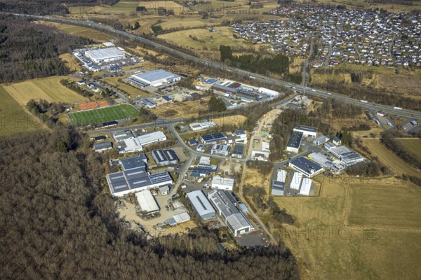 Aerial view, commercial area with sports field Hünsborn, Wenden, Sauerland, North Rhine-Westphalia, Germany, DE, Europe, football pitch, football stadium, commercial enterprises, commercial area, commercial property, commercial site, commercial use, industrial area, industrial site, aerial photograph, aerial photography, aerial photography, sports, sports facilities, sports field, sports facility, stadium, overview, bird's-eye view, overview