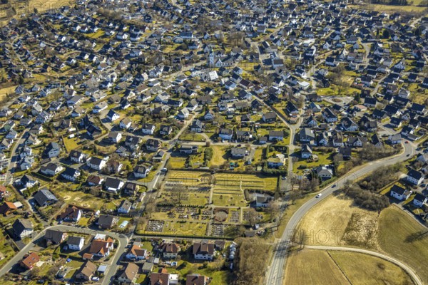 Aerial view, residential area and Roman Catholic parish church St. Kunibertus in the town centre, Hünsborn, Wenden, Sauerland, North Rhine-Westphalia, Germany, place of worship, DE, monument protection, Europe, religious community, place of worship, property tax, holy site, real estate, church, parish, denomination, aerial view, aerial photography, aerial photography, religion, religious site, overview, bird's-eye view, residential area, living and life, residential area, residential quality, residential quarter, housing estate, residential district, birds-eyes view, overview