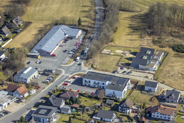 Aerial view, construction site and new building Kita GFO Kindergarten St. Anna Hünsborn, Über der Delle, shopping centre Nahkauf supermarket at roundabout Siegener Straße, Hünsborn, Wenden, Sauerland, North Rhine-Westphalia, Germany, DE, Europe, kindergarten, day care centre, day care centre, aerial view, aerial photography, aerial photography, overview, bird's-eye view, overview