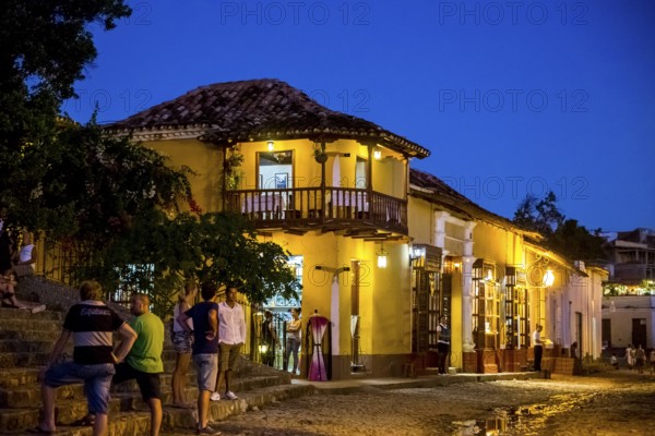 Restaurant and pub in the old town of Trinidad with visitors during the blue hour, Trinidad, Cuba, Sancti Spíritus, Cuba, Sancti Spíritus