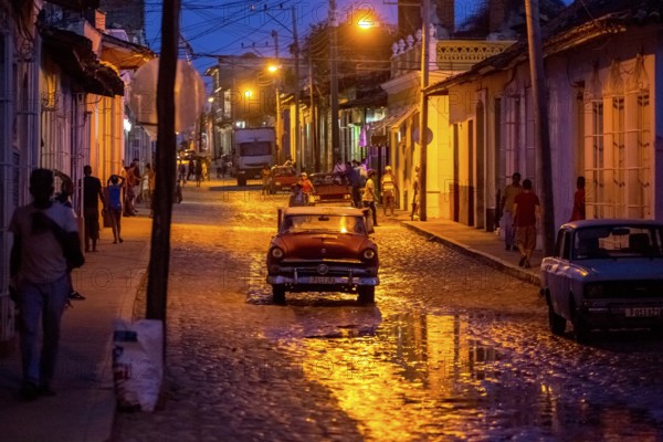 Night-time street scene in the old town of Trinidad with vintage car and lanterns, Trinidad, Cuba, Sancti Spíritus, Cuba, Sancti Spíritus