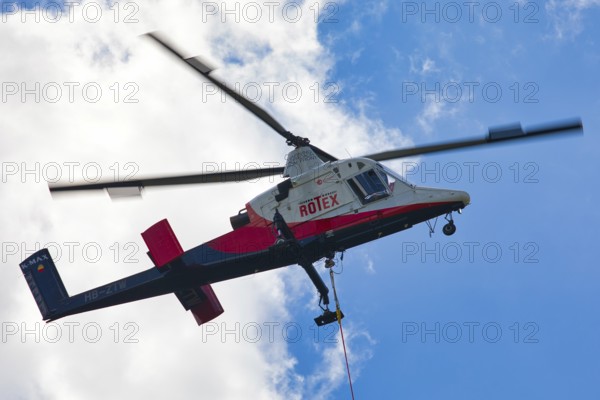 Detailed view of a helicopter with Rotex logo in the sky, transport helicopter, timber transport, Saas Grund, Canton Valais, Switzerland